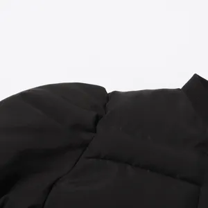 Black puffer jacket detail showcasing the stylish trumpet sleeve and ribbed collar design.