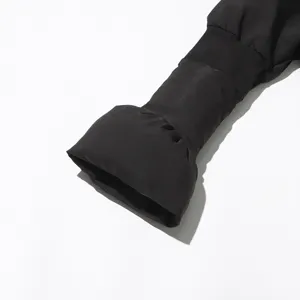 Black padded coat sleeve detail featuring trendy flared cuffs for women stylish winter outerwear.