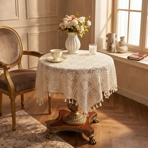 Beige crochet lace tablecloth with tassels, vintage European style round table cover for home decor.