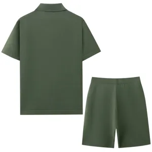 Detailed back view of dark green knit polo shirt and matching shorts set, showing texture.