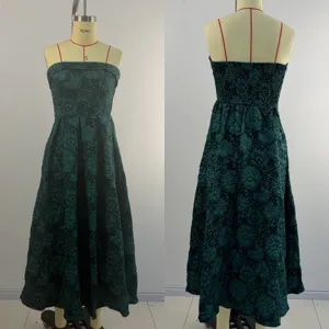 Green floral jacquard midi dress detail showing the elegant strapless design and back shirring.
