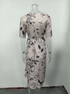 Floral print dress detail showcasing the pink fabric back view, short sleeves and waist cinch.