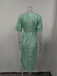 Detailed back view of the mint green floral print short sleeve midi dress, elegant slim waist.
