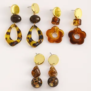 Detailed view of trendy Maillard style leopard print and flower drop earrings for women.