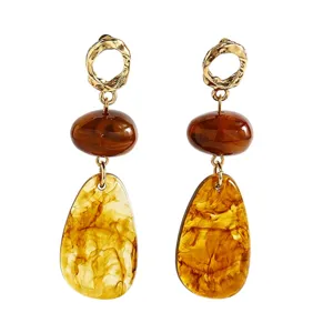 Chic brown resin drop earrings with gold textured rings, elegant vintage style for women.