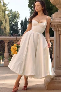 Detailed view of the French style white bustier midi flare dress with boned bodice and straps.