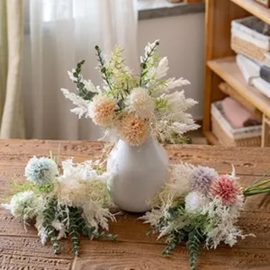 Artificial pampas grass bouquet detail, home wedding decorative faux flower plant arrangement.