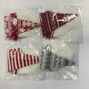 Knitted faceless old man wine bottle cover Christmas holiday table decoration detail