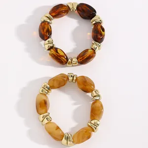 Retro unregelmäßige Harzperlen und goldene CCB Metall Abstandsarmband Set Modeschmuck.