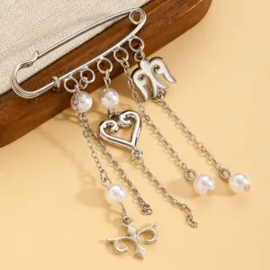 Exquisite silver-tone safety pin brooch with pearls, heart charms, and delicate chains for women.