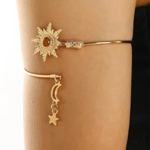 Vintage gold sun arm cuff upper arm bracelet with dangling moon star charms bohemian jewelry.