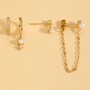 Gold earring set for women featuring elegant pearls and sparkling zircon stones.