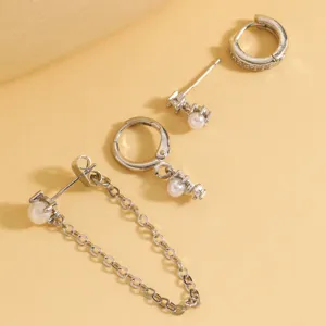 Zircon pearl earring set detail view, featuring multi-style silver metal studs and hoops.
