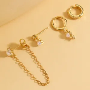 Detail shot of gold-plated multi-style earring set with pearls and sparkling cubic zirconia.