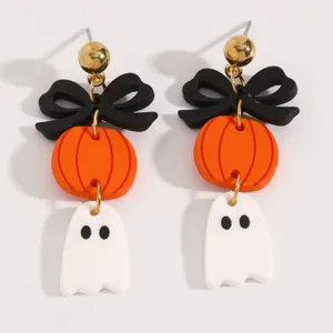 Pendientes de calabaza fantasma de Halloween con lazo negro y tachuelas doradas para fiesta.