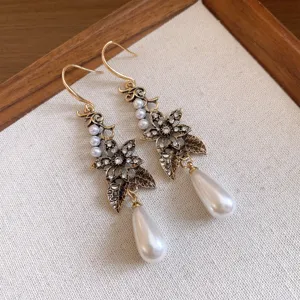 Vintage gold-tone pearl rhinestone drop earrings, elegant floral dangle jewelry for women.