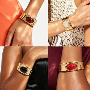 Wide gold metal cuff bracelet with colorful oval gemstone statement jewelry for women