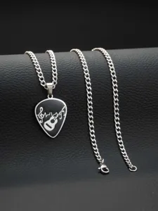Stainless steel guitar pick pendant necklace, music note detail close-up jewelry accessory.