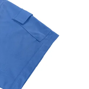 Close-up detail of blue men t-shirt sleeve cuff, showing fabric texture and pocket.