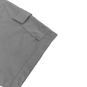 Grey t-shirt sleeve cuff detail, mesh fabric texture, casual men clothing close up view.