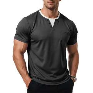 Men's short sleeve pocket detail view, charcoal grey Henley top with fake double layer collar.