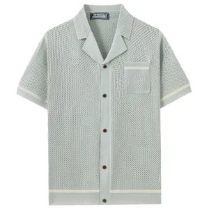 Detailed view of the light green knitted hollow-out short sleeve shirt with Cuban collar.