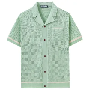 Detailed close-up of the light green knitted Cuban collar short sleeve shirt fabric.