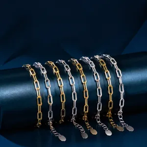 Silver and gold paperclip chain bracelet detailed view, adjustable length stylish jewelry accessory.