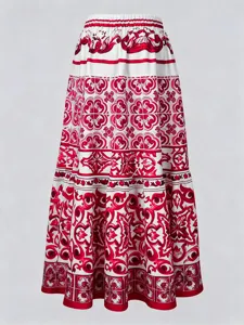 Detailed view of women red white printed resort mid-length beach skirt fabric pattern.