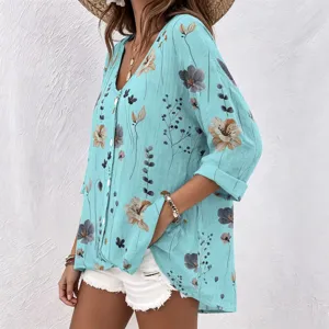 Detailed view of the stylish floral print V-neck blouse with front buttons and long sleeves.
