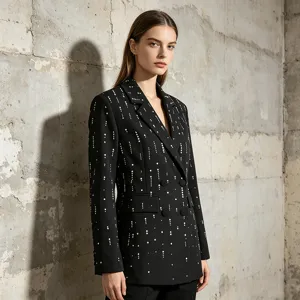 Women black blazer with pearl embellishments detailed shot showcasing fabric and design.