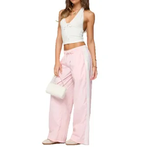 Women's summer pink casual wide-leg pants with drawstring and matching white halter top.
