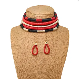 Close-up detail of a multi-layer woven statement choker necklace and matching earrings set.