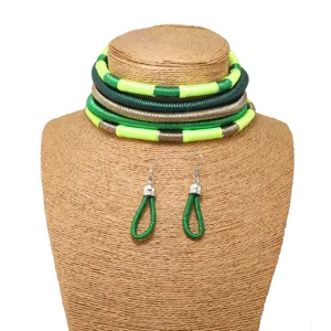 Close-up detail of multi-layer woven choker necklace and matching earrings in vibrant green and gold.