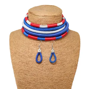 Detailed view of African style woven choker necklace and earrings set in vibrant blue, red, silver.