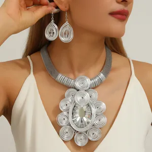 Detailed closeup of the extravagant handmade silver wire woven crystal necklace and earrings set.