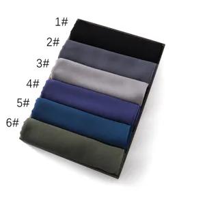 Detailed view of solid color chiffon long scarf rolled neatly in tray, color options 1 to 6.