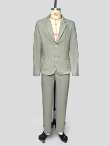 Detail view of men's light green suit jacket and trousers set, elegant business wear.