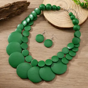 Bohemian green wooden bead layered statement necklace and earrings set, handmade ethnic style detail.
