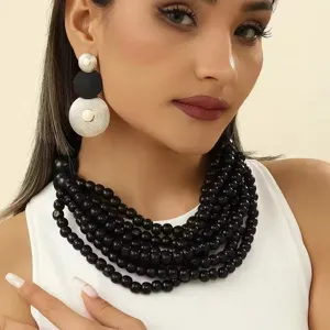 Afrikanische boho handgemachte holzperlen mehrlagige kette und geometrische ohrringe set.