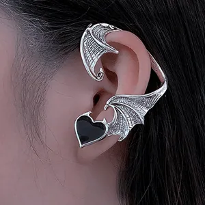 Gothic punk alloy dragon wing ear cuff detail close-up showing intricate metal texture