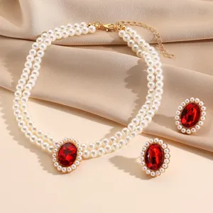 French vintage faux pearl choker necklace and matching red crystal earrings jewelry set for women.
