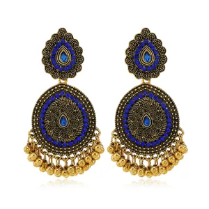 Ethnic vintage gold-toned alloy blue rhinestone dangle earrings with charming hanging beads.