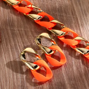 Fashion fluorescent orange and gold twisted chain necklace and earrings jewelry set.
