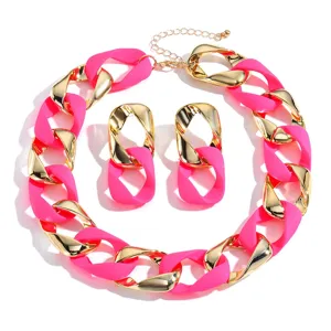 Chunky chain necklace and earrings set in hot pink and gold, stylish fashion jewelry.