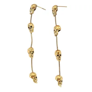 Punk retro gold-plated skull tassel long drop earrings for women, gothic Halloween style jewelry.