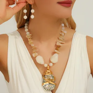 Exquisite teardrop crystal pendant necklace and earrings set with irregular stones for women.
