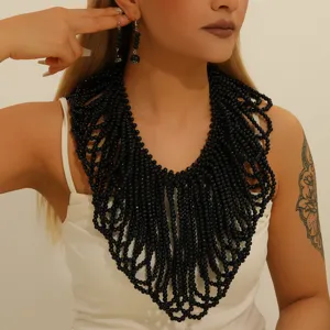 Bohemian black beaded multi-strand statement necklace and earrings set for women.