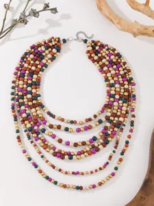 Boho multi-layer wooden bead necklace detail, colorful wooden beads layered chain close-up.