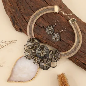 Exaggerated gold mesh choker necklace and spiral earrings set with large white resin pendant for women.